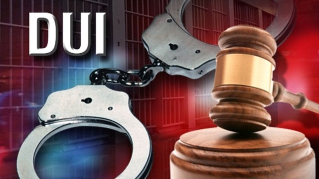 Gavel and handcuffs with DUI text, symbolizing legal consequences of driving under the influence.